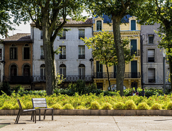 street with houses and park bench